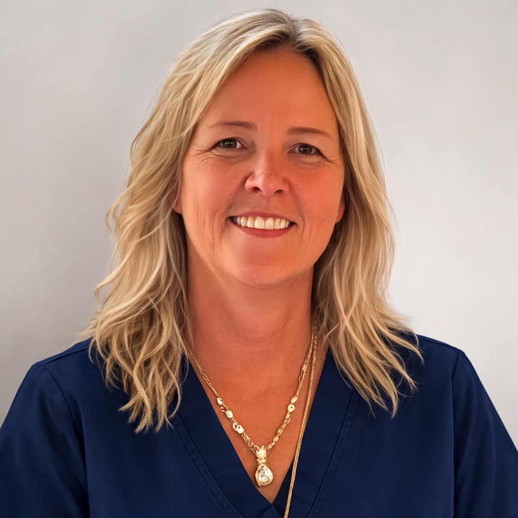 Sandra Thorp RN BN, Founder and CEO of OBA Nursing Academy, in navy scrubs